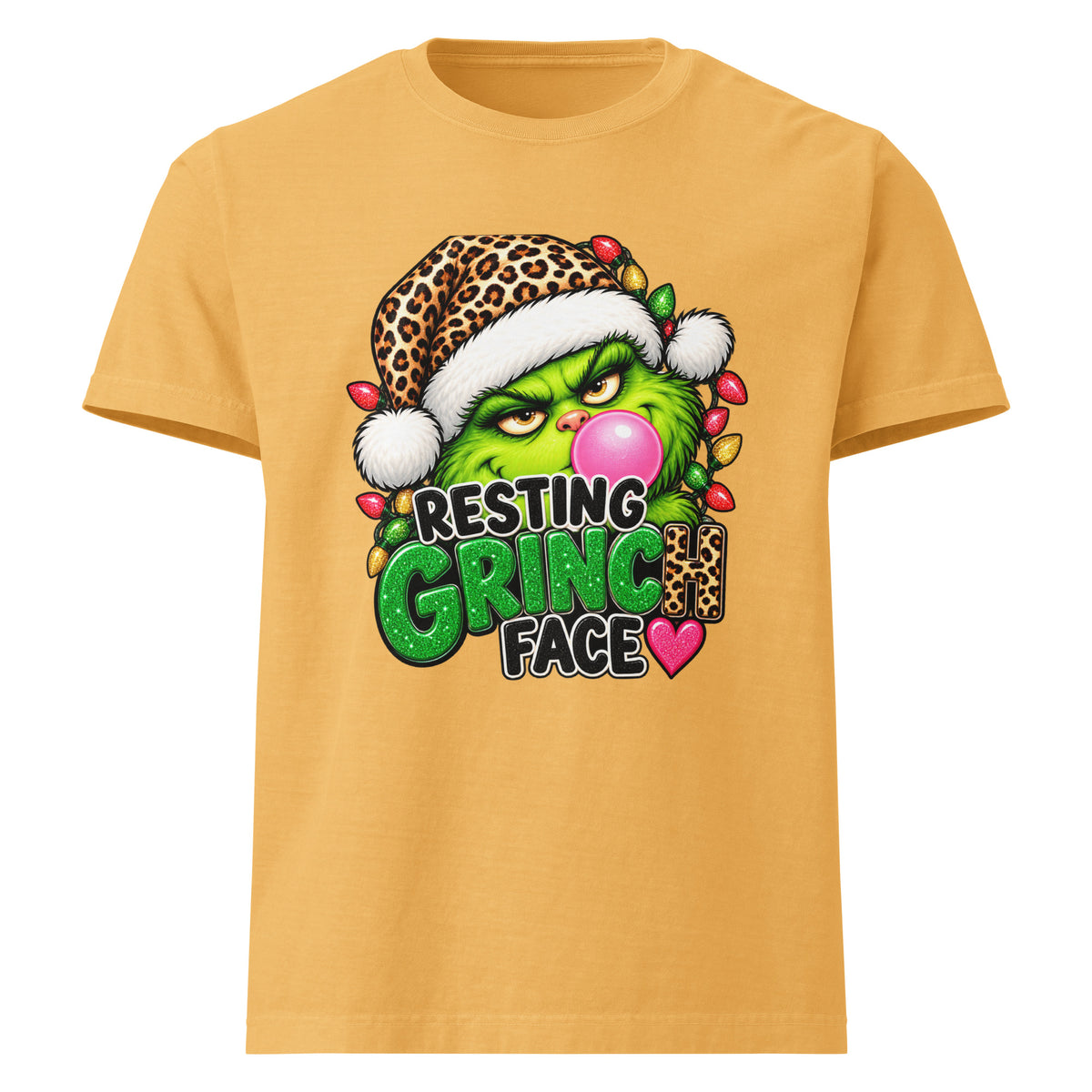 Resting Grinch Face Christmas graphic T-shirt in washed mustard, front view.