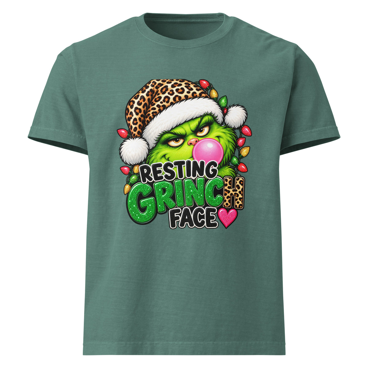 Resting Grinch Face Christmas graphic T-shirt in washed pine green, front view.